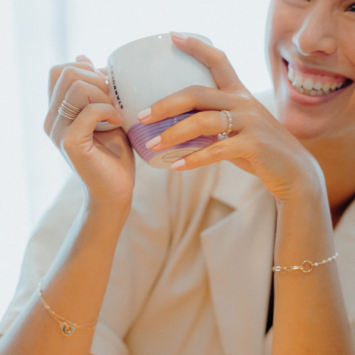 woman with jewels and cup of coffee