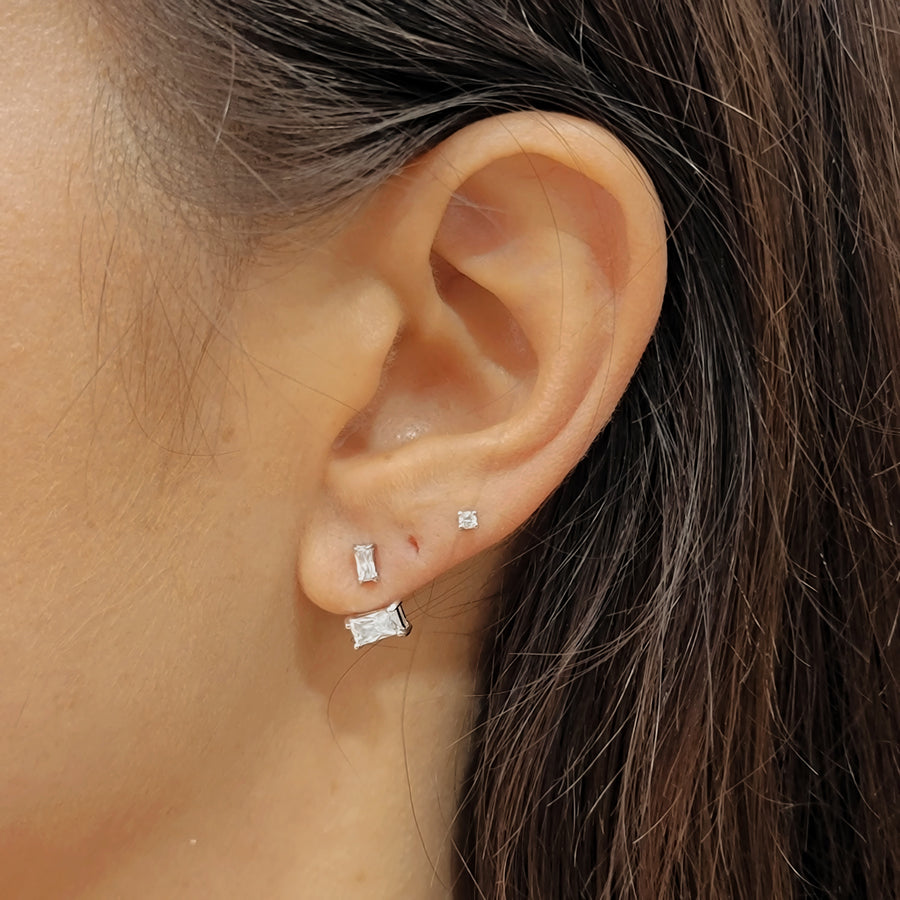 woman wearing silver earrings