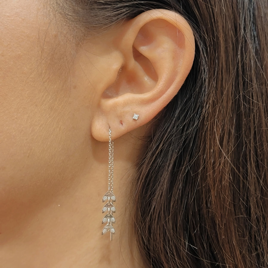 woman wearing silver earrings