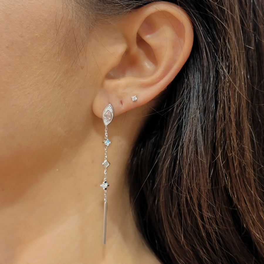 woman wearing silver earrings