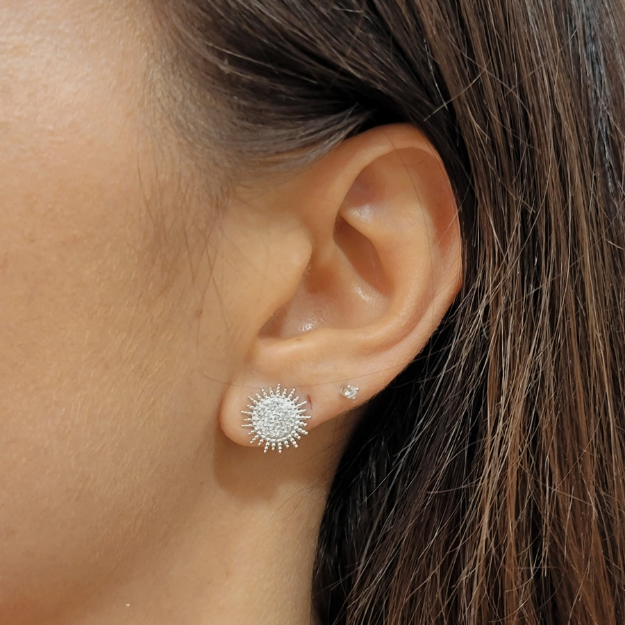 woman wearing silver earrings