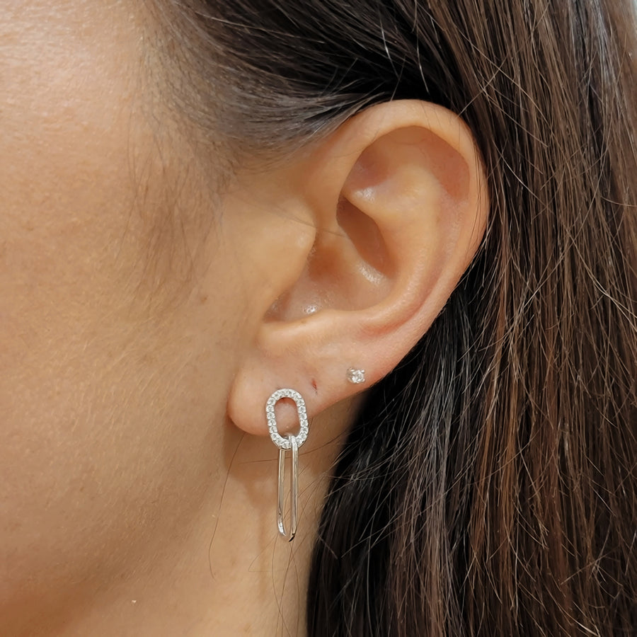 woman wearing silver earrings