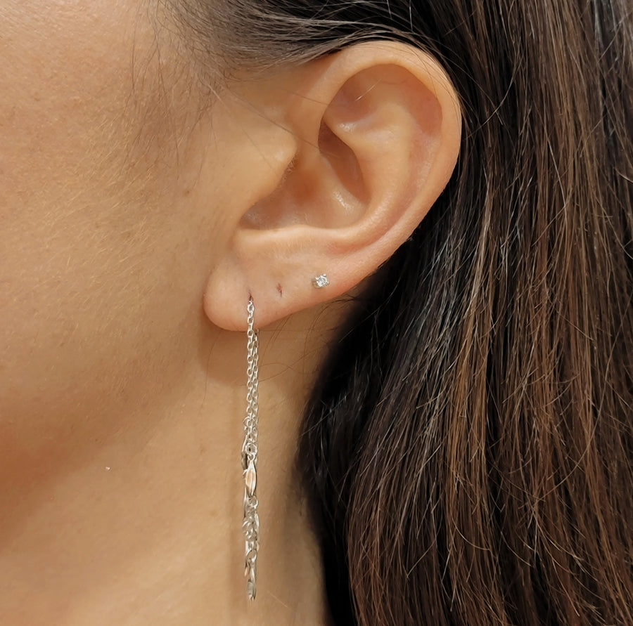 woman wearing silver earrings