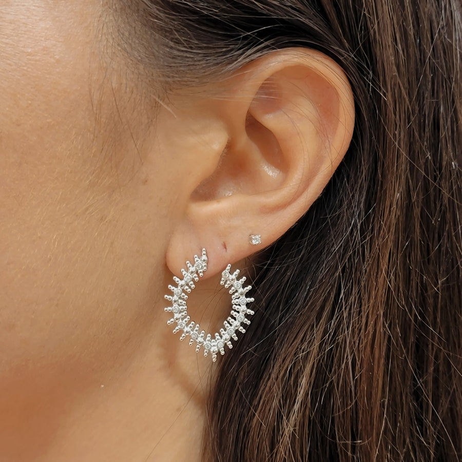 woman wearing silver earrings