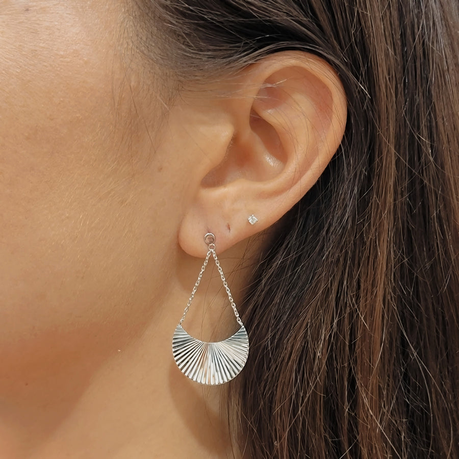 woman wearing silver earrings