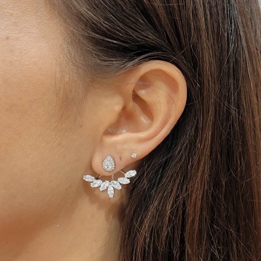 woman wearing silver earrings