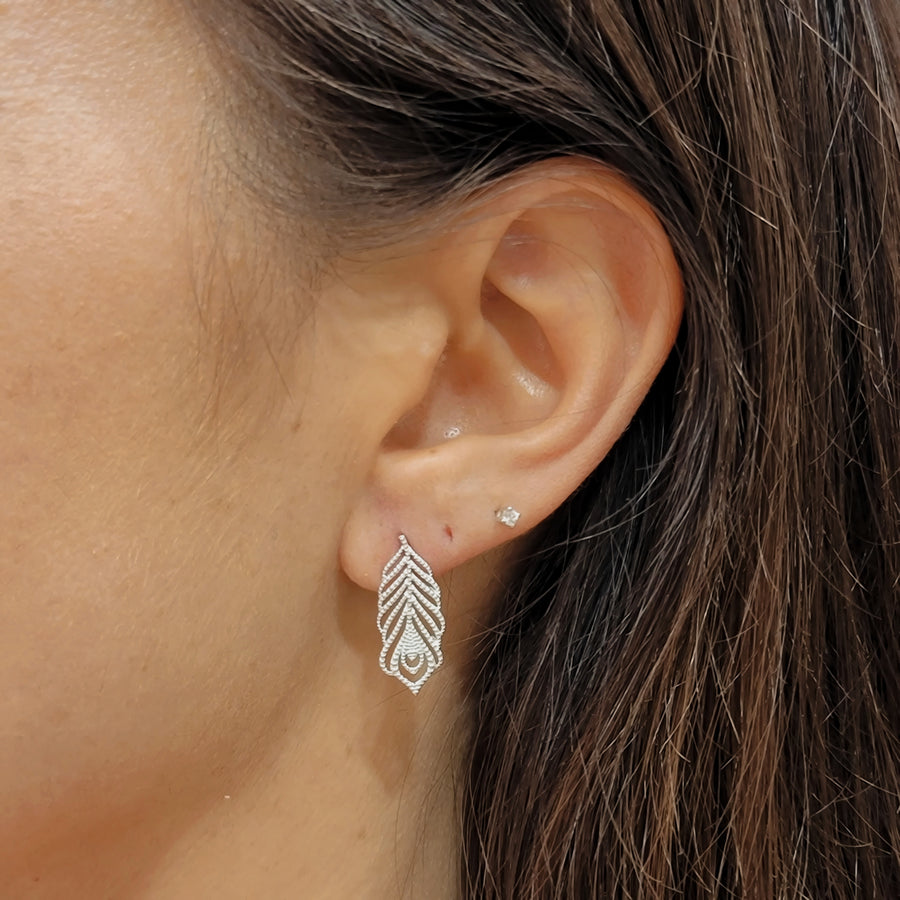 woman wearing silver earrings