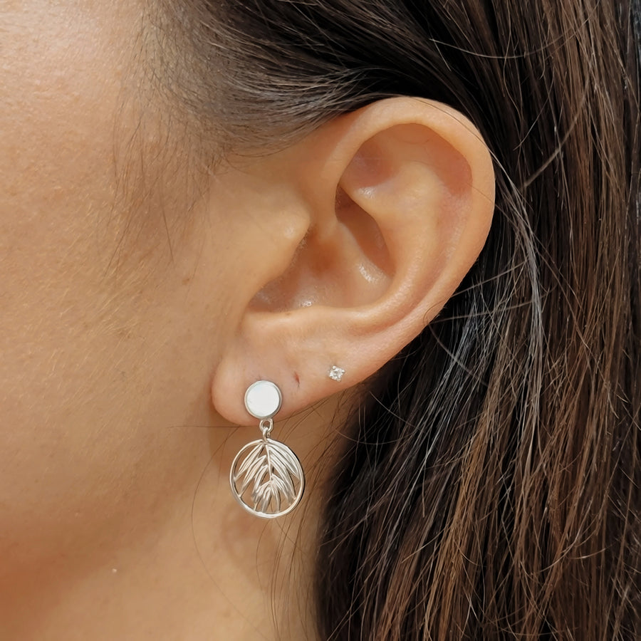 woman wearing silver earrings