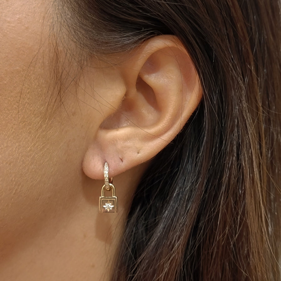 woman wearing gold plated earrings